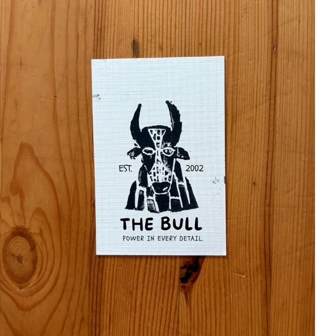 The Bull pub logo, hand-carved and printed on a card