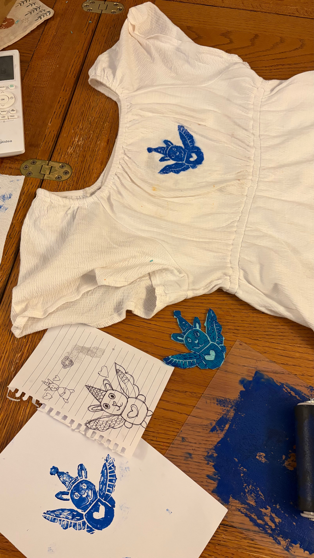 White dress upcycled with a blue bunny print