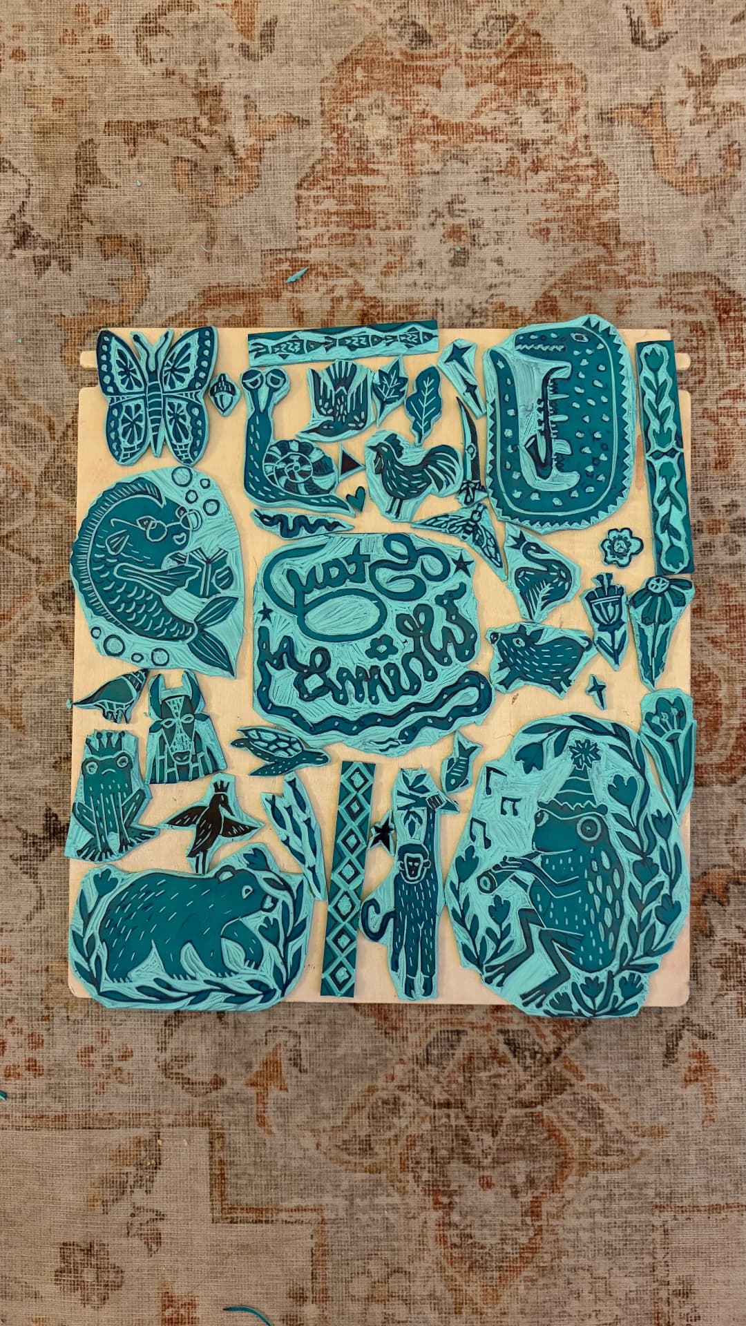 A collection of hand-carved lino blocks ready for printing