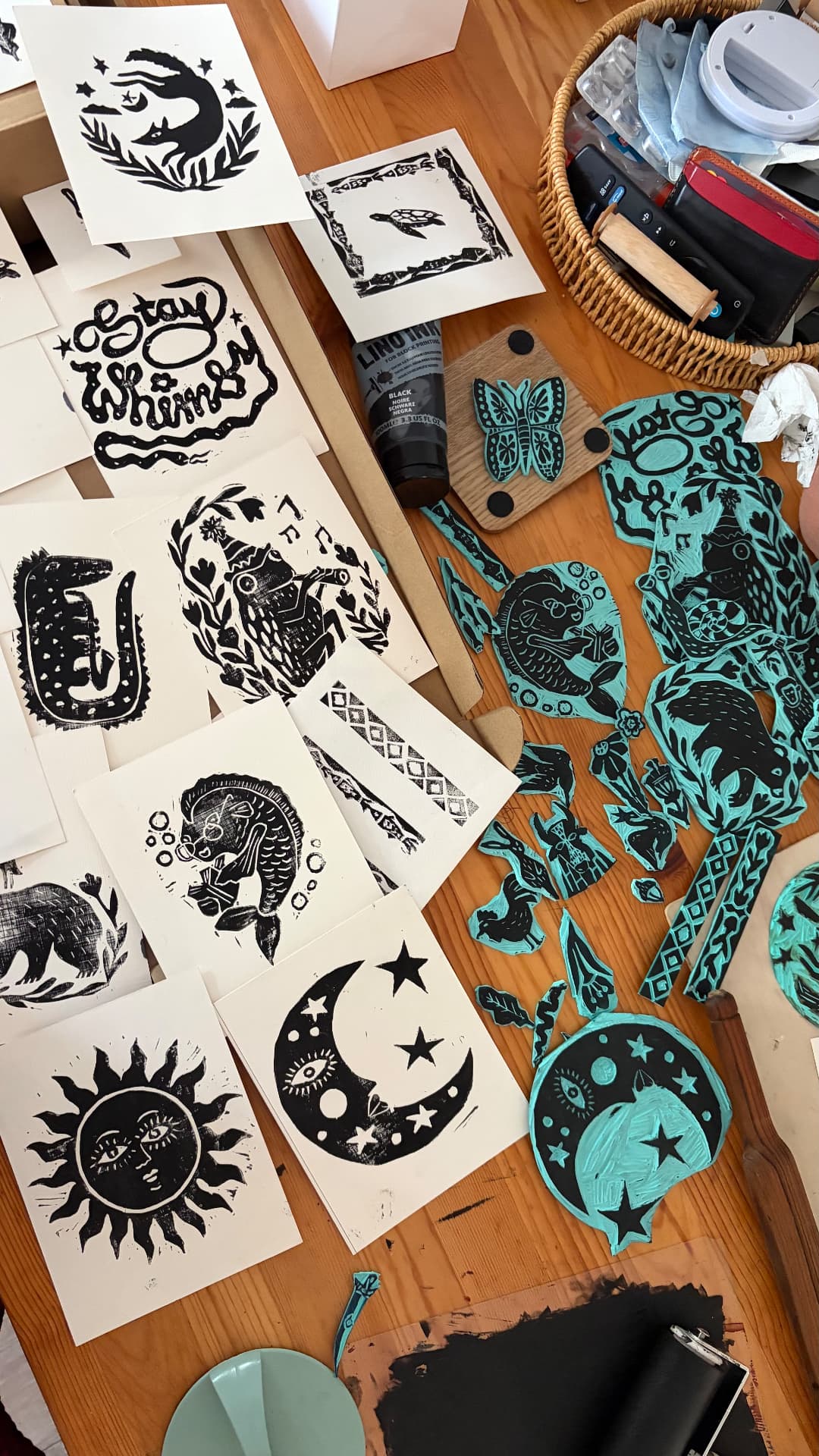 A set of three hand-printed lino prints
