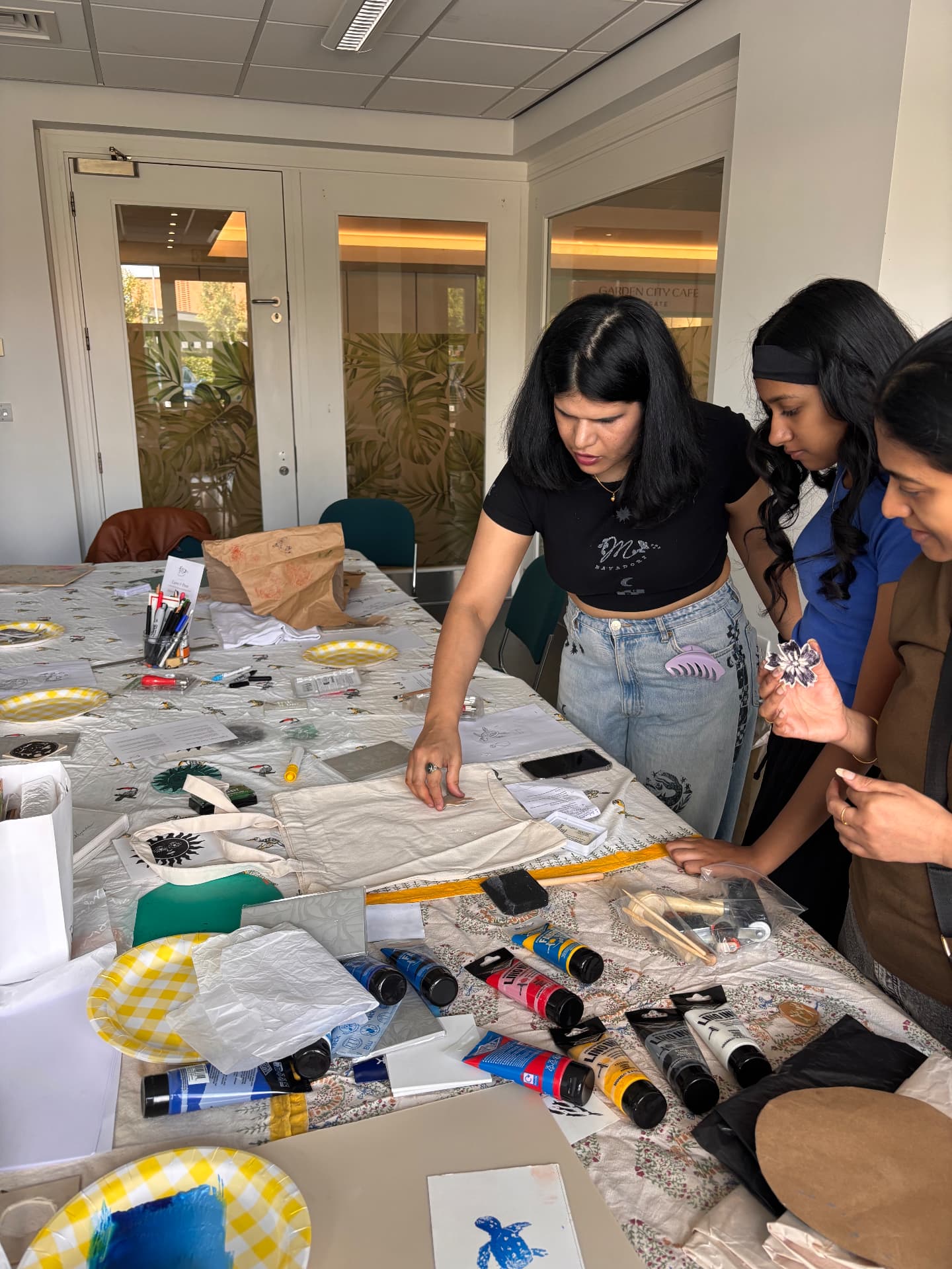 People carving lino together mid-session at a Mayadori workshop