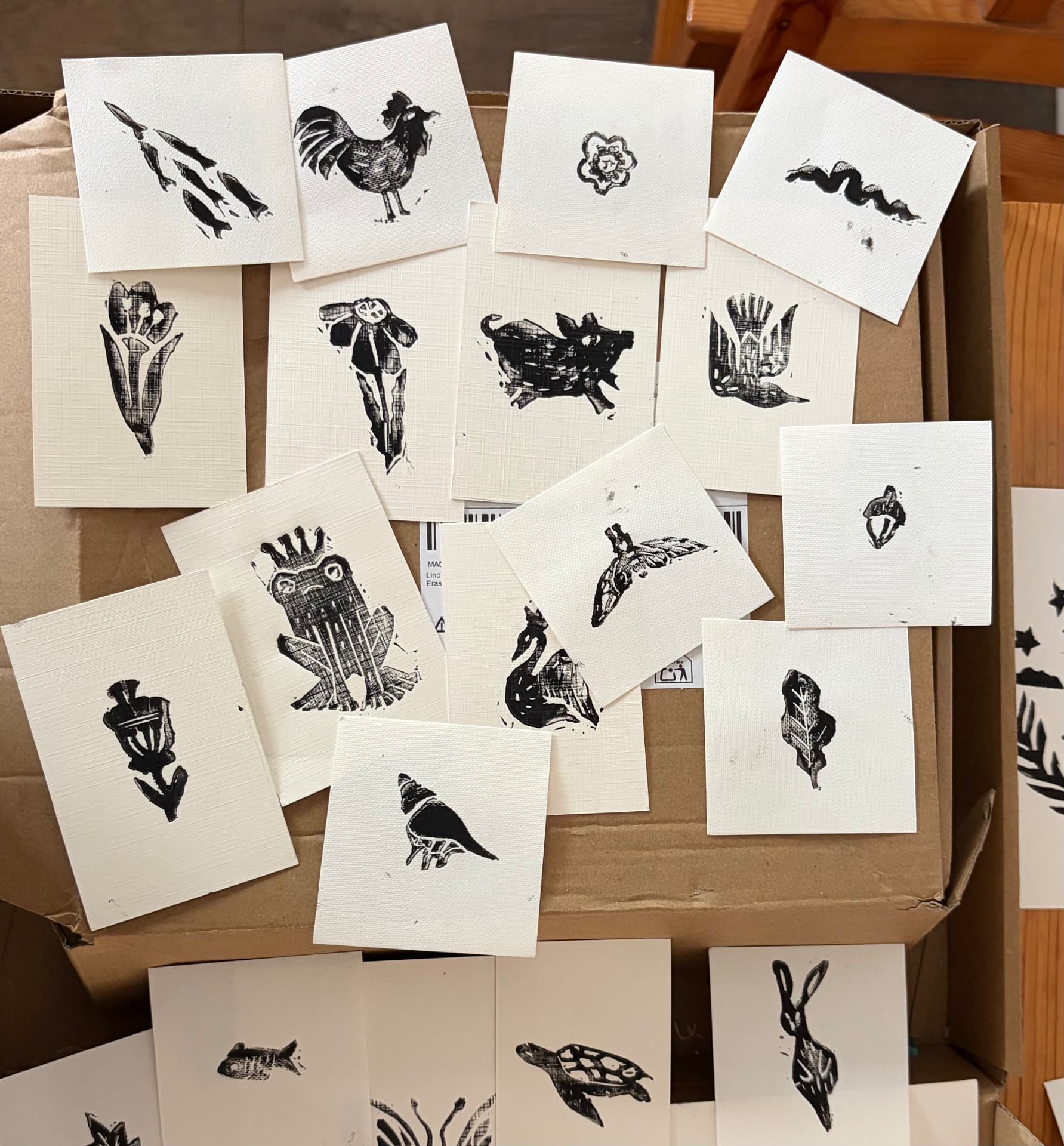 A box full of lino-printed animal motif cards