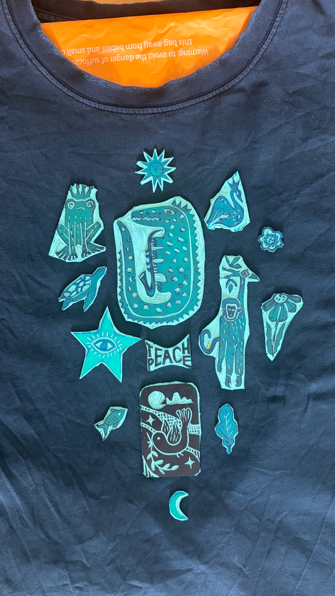 Upcycled navy tee with hand-carved prints