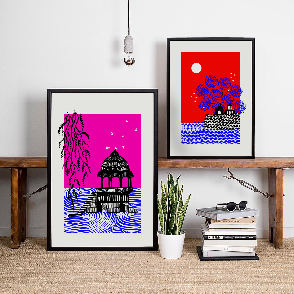 Pair of framed illustrated prints — temple and red moon