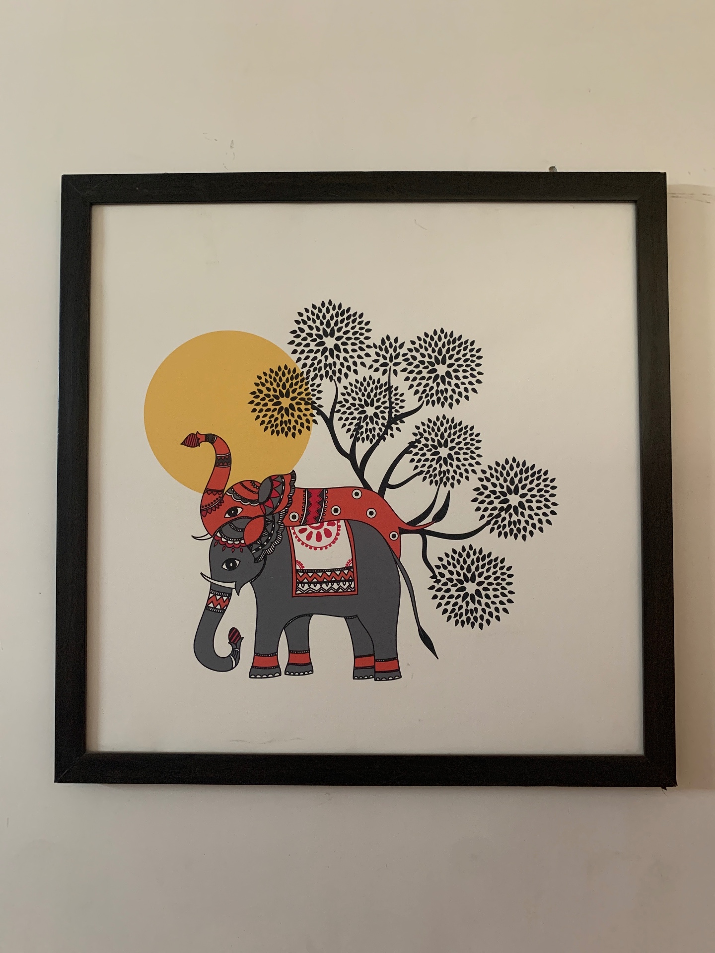 Framed illustrated elephant artwork with sun and tree