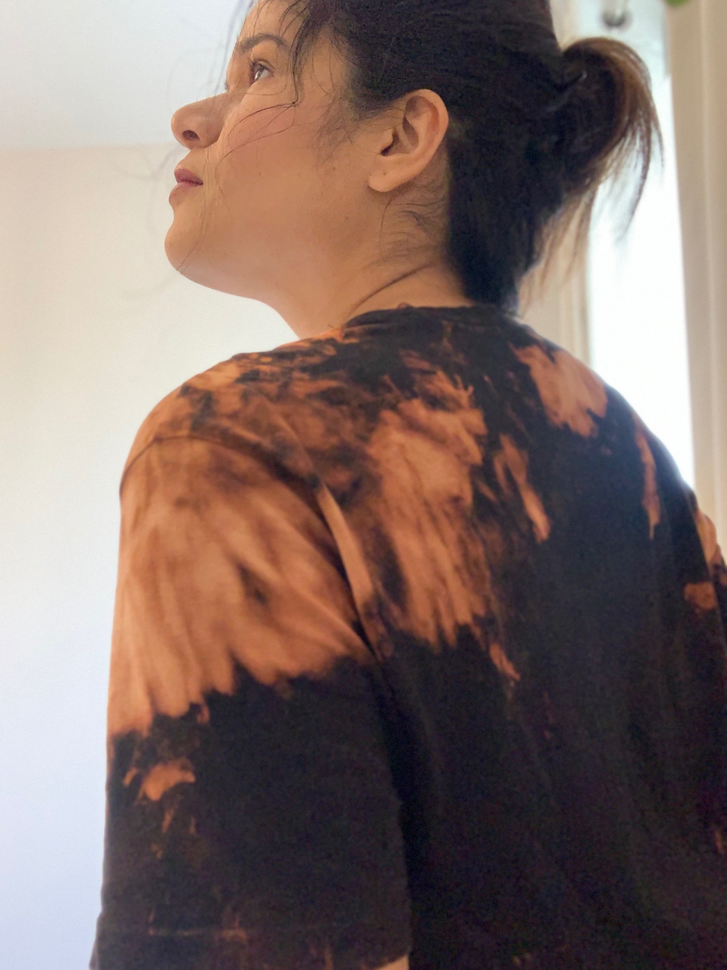 Upcycled bleach-dyed tee — back detail