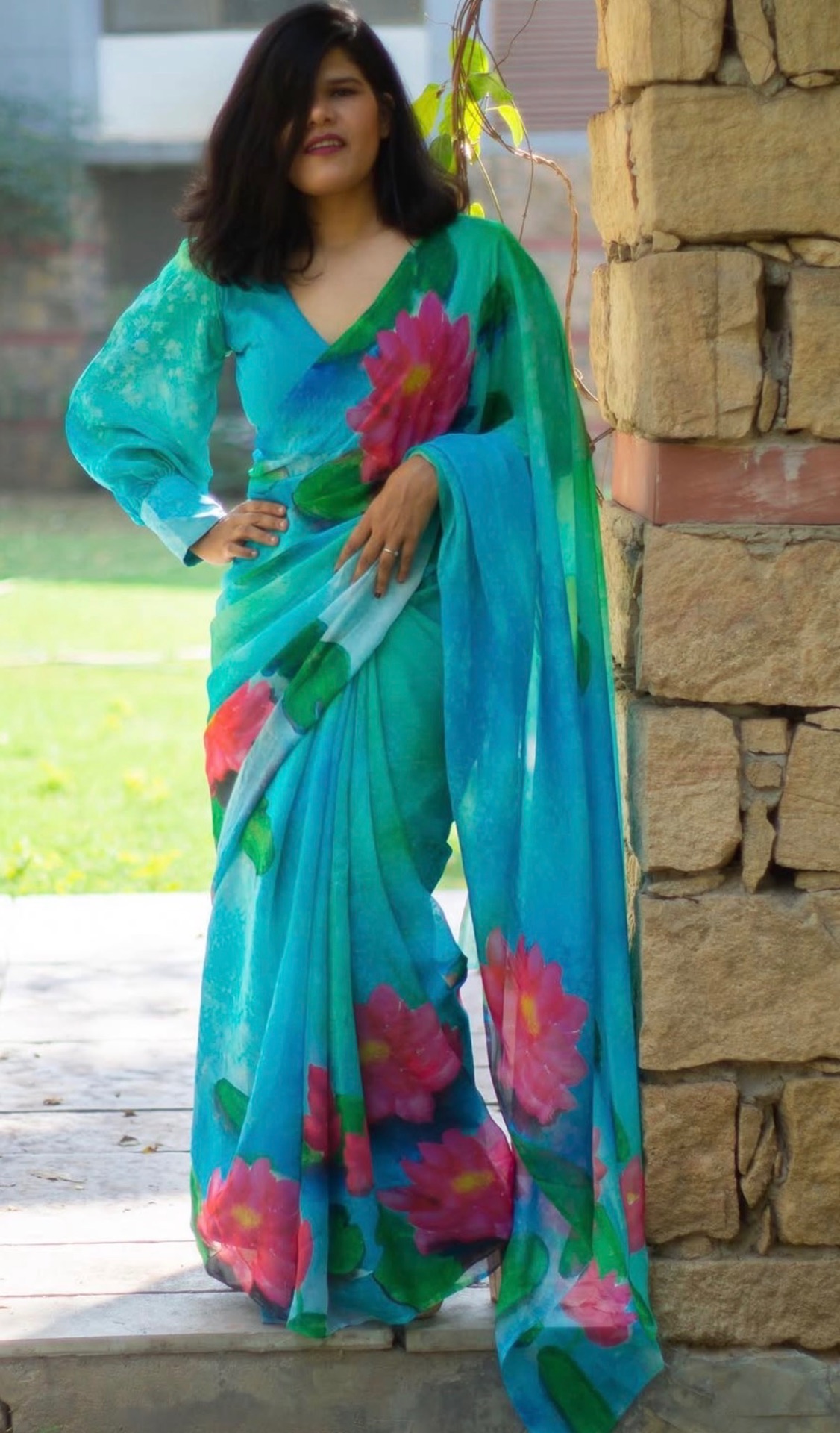 Hand-painted lotus saree styled outdoors